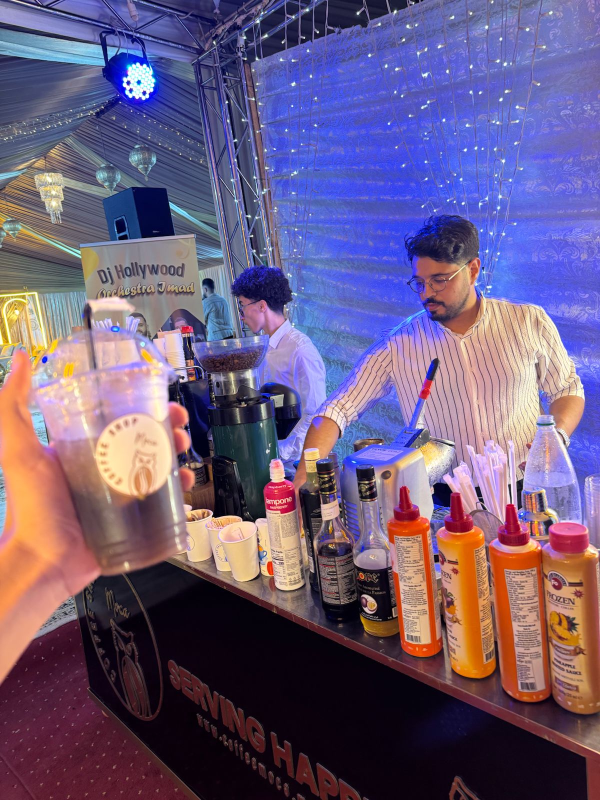 Coffee Moca team serving drinks at an evening celebration
