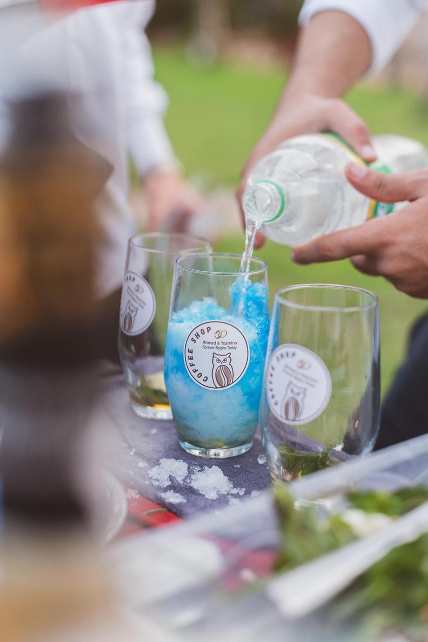 Barista preparing a blue refresher drink